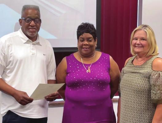 MAIN STREET Baptist Church Pastor James L. Wesley and his wife, Janet, receive the Juneteenth proclamation from Excelsior Springs Mayor Sharon Powell. BRIAN RICE | Staff