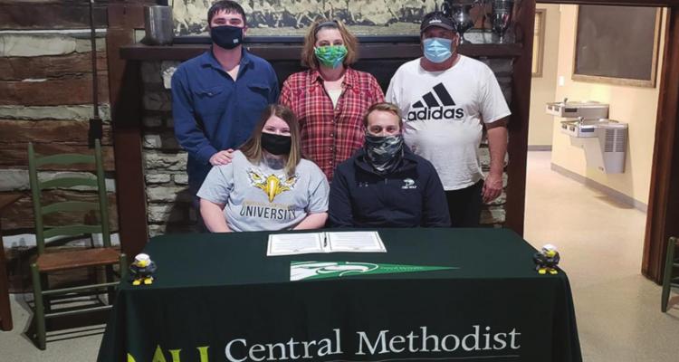 HOPE CHAPPEL, front left, signs with CMU. Beside her is coach Stephen Main. Back row, from left are her brother, Hunter; and parents, Jen and Jeff. DUSTIN DANNER | Staff