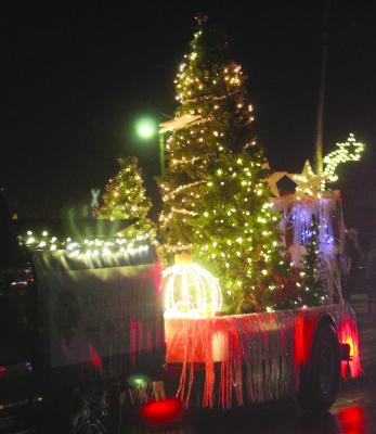 ORRICK LIONS CLUB pulls their lighted float through the Christmas Parade.
