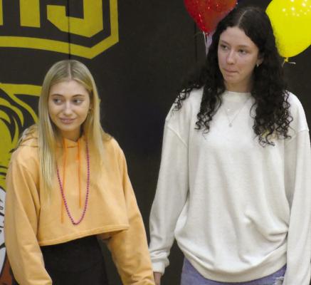 CARLY DOLT (left) and Reese Roberts are applauded for their volleyball achievements. ELIZABETH BARNT | Staff