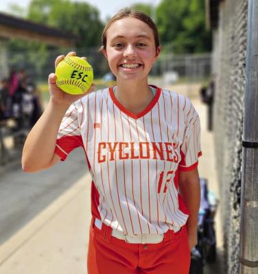WILLA SCHREIER displays a home run ball after swatting a four-bagger during Heartland World Series competition this summer. DUSTIN DANNER | Staff