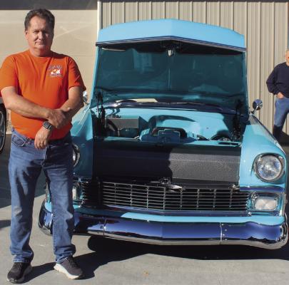 ROOSTERS CLUB member Paul Reed shows off his light blue 1956 Chevrolet. MIRANDA JAMISON | Staff