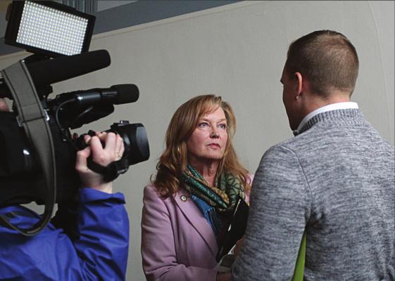 AFTER ANOTHER contentious meeting in February, Ray County Eastern Commissioner Luann Ridgeway answers questions for one reporter, but not others waiting to answer questions in the same hallway in the Clay County Administration Building on the Liberty Square. ‘