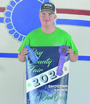 DANTIN McBEE, a student in the Excelsior Springs School District, displays his Best of Show Overall award for shooting sports after finishing the archery competition July 15 at the Ray County Fairgrounds. SHAWN RONEY | Staff