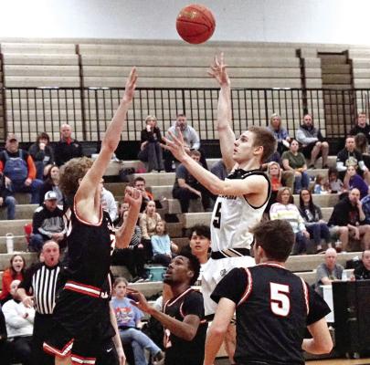 CARSON GHOLSON, an Excelsior Springs junior, puts up a floater for two points last week during a home meeting with Oak Grove in varsity boys basketball. TIM HARLAN | Submitted