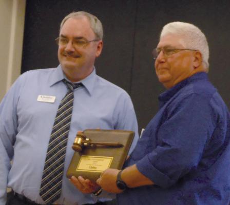 BRIAN RICE (left) acknowledges Bill Westerheide with a plaque for his years of service. ELIZABETH BARNT | Staff