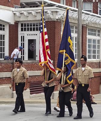 ROTC cadets carry the flag during the parade, as well as posting the colors before hand. SHARON DONAT | Staff