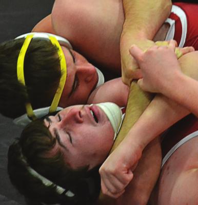 JUNIOR AYDEN DOLT places his opponent in a cradle to pick up a win by pin during triangular action St. Joseph Benton. DUSTIN DANNER | Staff