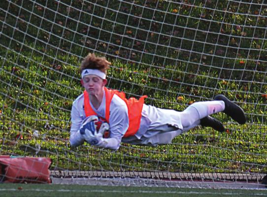 JUNIOR GOALKEEPER Zach Dimes goes parallel to the ground to make a save in the first half of Excelsior Springs’ Class 2 state semifinal game with Perryville. DUSTIN DANNER | Staff