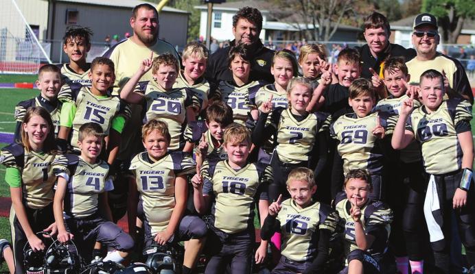 THE EXCELSIOR SPRINGS FOOTBALL ASSOCIATION’S fifth-grade squad enjoys winning its West Central Youth Football League championship. 