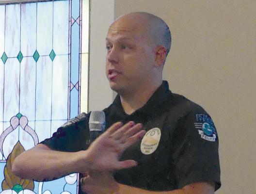 EXCELSIOR SPRINGS Police Lieutenant Ryan Dowdy addresses citizens’ concerns about the Boarding House Districts ongoing concerns at the neighborhood meeting. ELIZABETH BARNT | Staff