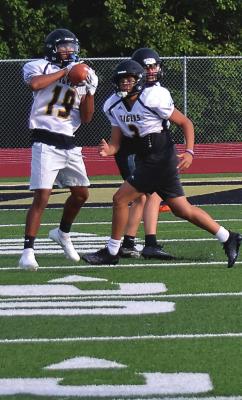 EXCELSIOR SPRINGS junior Dacey Hall intercepts a pass as the Tigers work on their defensive skills the first week of practice. MSHSAA set Monday as the first day for fall sports practices.