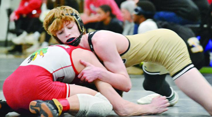 COOPER COLLINS, shown in control of his opponent, looks to repeat as a state champion for Excelsior Springs this season. DUSTIN DANNER | Staff