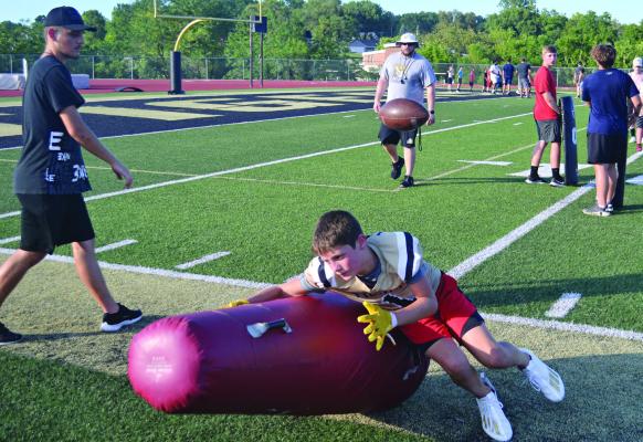 PAXTON LINGLE displays his tackling form during last week’s two-day camp for youth football players at Vic Bonuchi Field at Tiger Stadium. DUSTIN DANNER | Staff