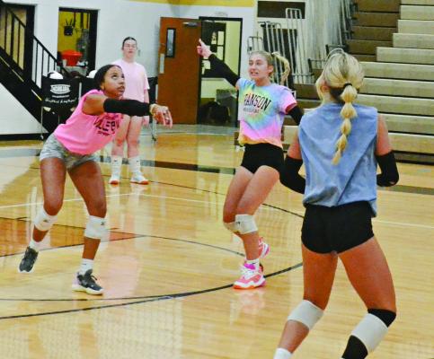 THE EXCELSIOR SPRINGS varsity volleyball team, shown practicing in the high school gym, is hungering for a district volleyball title. DUSTIN DANNER | Staff