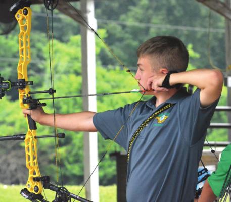 SILAS O’DELL takes aim during archery competition July 16 at the Ray County Fair in Richmond. SHAWN RONEY | Staff