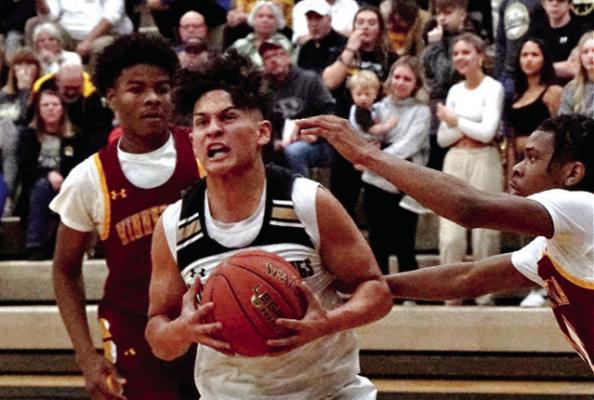JUNIOR JAKE ZAPATA attempts to secure the basketball during Excelsior Springs’ Jan. 30 meeting with visiting Winnetonka. TIM HARLAN | Submitted