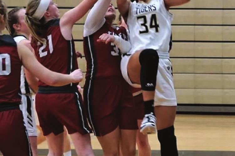 EXCELSIOR SPRINGS junior Lillian Mawby goes up for two of her six points in an MRVC West Division home win over Warrensburg. TIM HARLAN | Submitted Photo