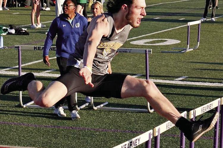 EXCELSIOR SPRINGS senior Gavin Wilmes clears a hurdle en route to a third-place finish in the boys 110-meter high hurdles April 6 at the Kearney Classic Invitational. TIM HARLAN | Submitted