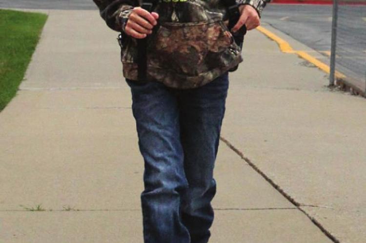A HUNTER HAPPY is on his way to school Tuesday.