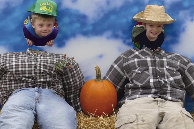 DAXTON FRY (left) and Brantlee Lane pretend to be scarecrows. ELIZABETH BARNT | Staff