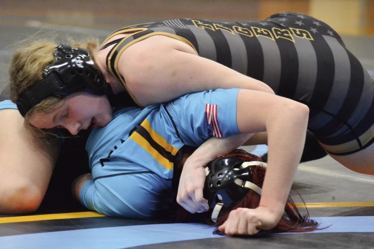 EXCELSIOR SPRINGS JUNIOR Jaylenn Hudlemeyer secures a half nelson to put her opponent on her back for a win by pin Jan. 18 at Grandview. DUSTIN DANNER | Staff
