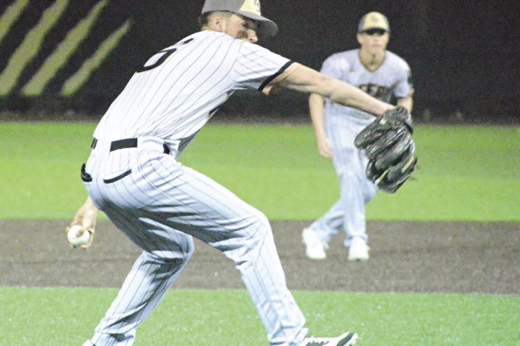 COLSON MOORE delivers in the seventh inning of the finale of Excelsior Springs’ Tuesday night home doubleheader.