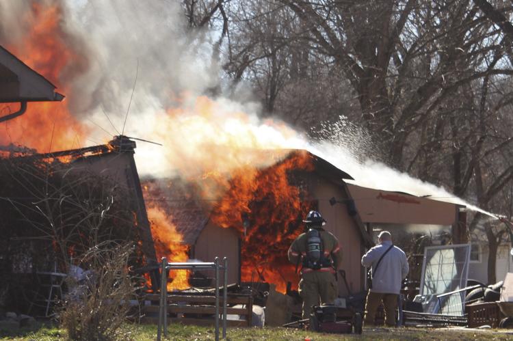 FISHING RIVER Fire Department and Excelsior Springs Fire Department work together to put out a fully engulfed structure fire. MIRANDA JAMISON | Staff
