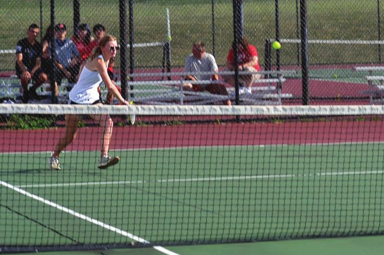 JUNIOR EMMA KERN approaches the ball to attempt a forehand shot. DUSTIN DANNER | Staff