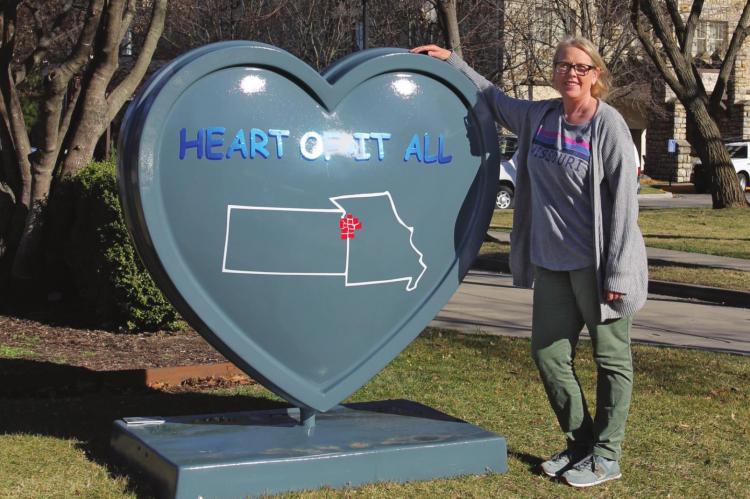 IN FRONT of The Elms Hotel and Spa, Excelsior Springs resident Cynthia Loflin says she likes having the city participate in the metrowide Parade of Hearts. J.C. VENTIMIGLIA | Staff