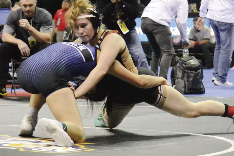 EXCELSIOR SPRINGS senior Vada Burton, right, grapples during the Class 1 state girls tournament, held Feb. 22-23 at Mizzou Arena in Columbia. DUSTIN DANNER | Staff