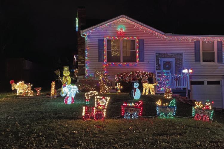 CURB APPEAL winners Brenda and James Bailey light up their neighborhood with festive decor. LAURA MIZE | Submitted