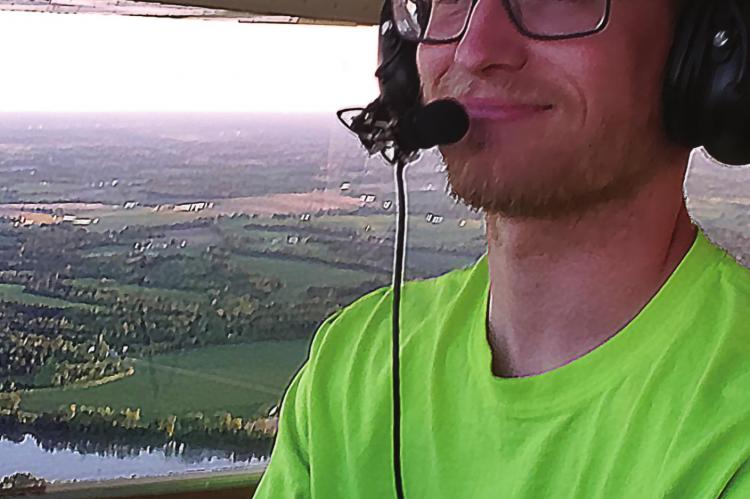 HAVING TRAINED at the Excelsior Springs Memorial Airport, Trent Adams earns his wings and is certified to pilot aircraft.