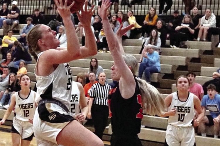 EXCELSIOR SPRINGS sophomore Kinley Rogers goes up for a layup to score two of her team-leading 11 points last week against visiting Oak Grove. TIM HARLAN | Submitted