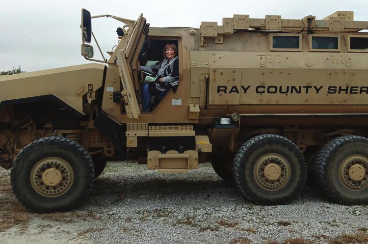 FROM BRIDGE OF HOPE, Connie Taylor takes the driver seat in a mine-resistant ambush protected, or MRAP, military surplus vehicle at the Ray County Sheriff’s Office in Henrietta. SHARON DONAT | Staff affiliate