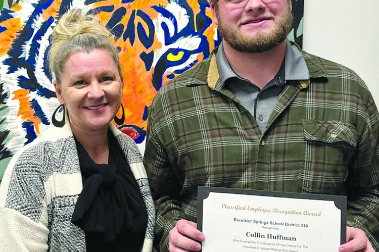 ESSD ASSISTANT SUPERINTENDENT Dr. Melissa Miller (left) recognizes Collin Huffman as employee of the month for his dedication to the district. Submitted
