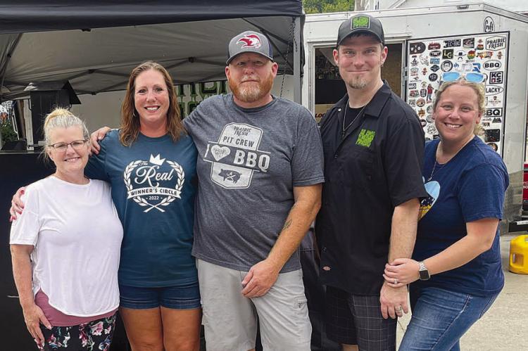 CHRISTY SERRAGE, BRE BIA, Brad Colter, and Darren and Tina McKown make up one of the many barbecue teams at the BBQ Fly-In on the River on Aug. 19 and 20 in Excelsior Springs.