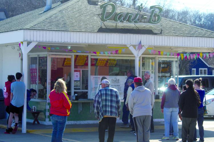COMMUNITY MEMBERS patiently wait for their sweet treats on opening day. MIRANDA JAMISON | Staff