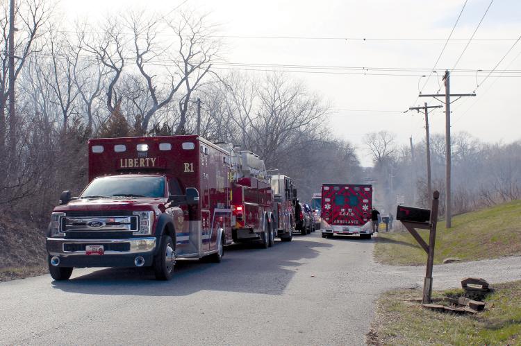 MIRANDA JAMISON | Staff SMOKE FILLS THE AIR as multiple agencies line the streets in front of Monday’s house fire in the 25000 block of Northeast 136th Street. Mutual aid departments respond to help fight the blaze and provide medical assistance. See full story on page 12.
