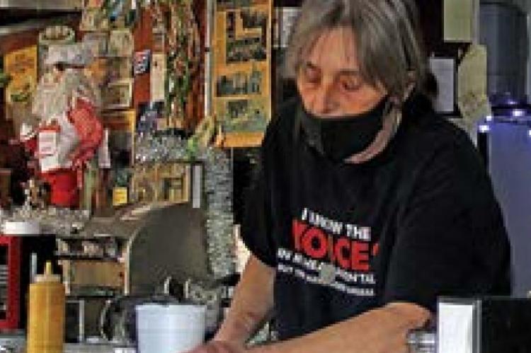 OWNER Brenda Fudge gets a to-go order ready at Ray’s Lunch, 231 E. Broadway, Excelsior Springs.