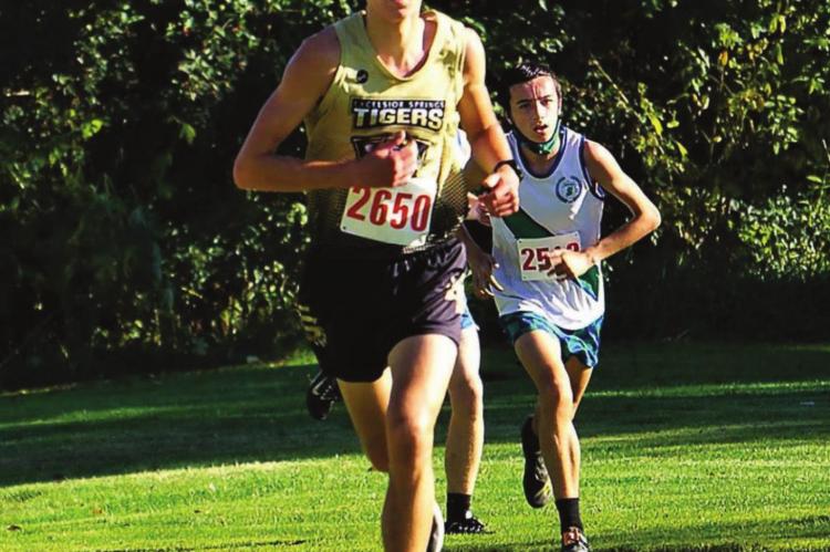 JUNIOR TYLER RUMORE paces the Tigers Oct. 6 at the Excelsior Springs Cross Country Invitational. PROVIDED COURTESY OF TIM HARLAN