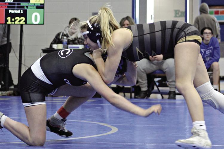 SOPHOMORE LILLAH SHUE (right) snaps down her opponent and prepares for a takedown during Jan. 19 tournament action at Brookfield. DUSTIN DANNER | Staff