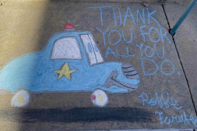 Robbie Farabee celebrated the Excelsior Springs Police Department thanking them for all they do, with a cartoon police car sketched on the sidewalk. ROBBIE FARABEE | Submitted