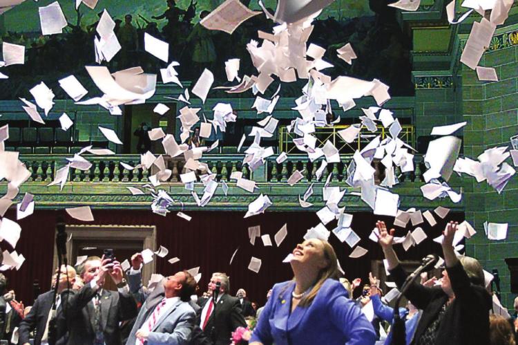 THE TRADITION of throwing paper in the air at the end of the annual state House session in Jefferson City is embraced in 2020 with enthusiasm and about three reams of paper by Rep. Sarah Walsh.