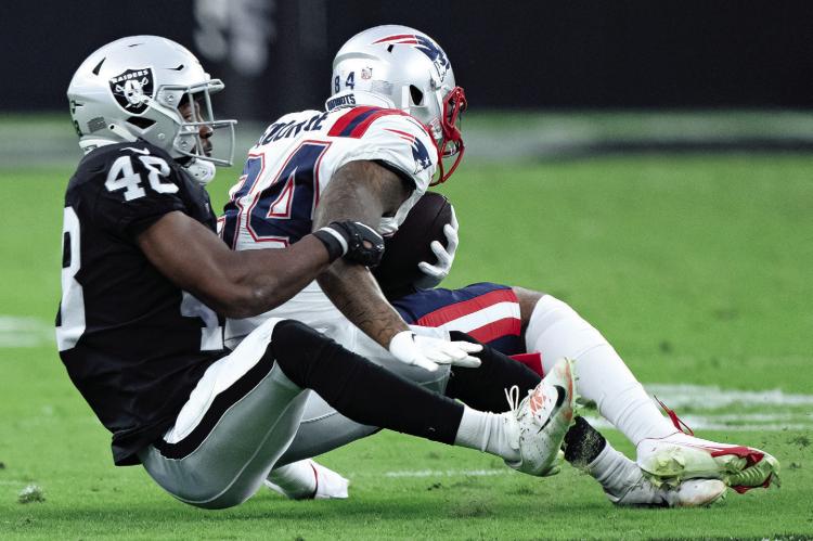 SAM WEBB (left), shown here making a tackle during a 2022 preseason game, will have a few weeks between serving as grand marshal for the Waterfest Parade and reporting to training camp for the Las Vegas Raiders. COURTESY OF THE LAS VEGAS RAIDERS | Submitted