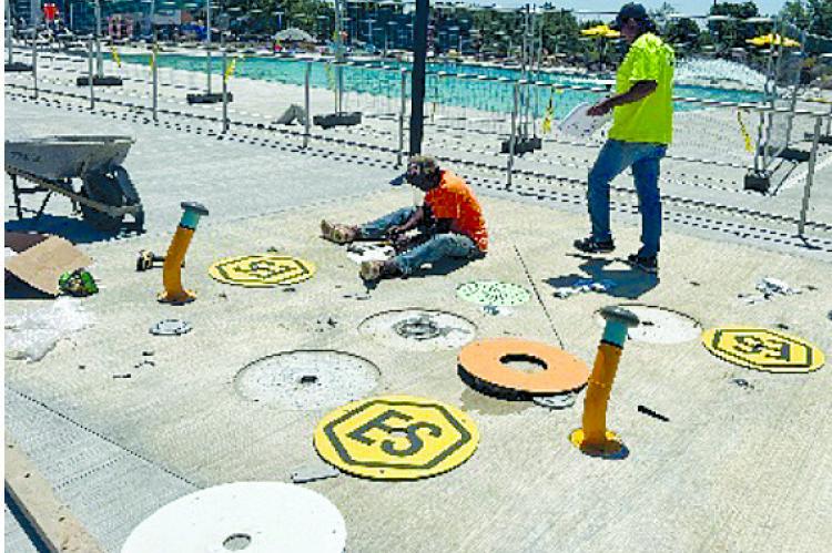 SKYVUER IMAGERY, COURTESY OF JESSE HALL | Submitted CONSTRUCTION WORKERS are finalizing the spray pad fixtures for the outdoor pool.