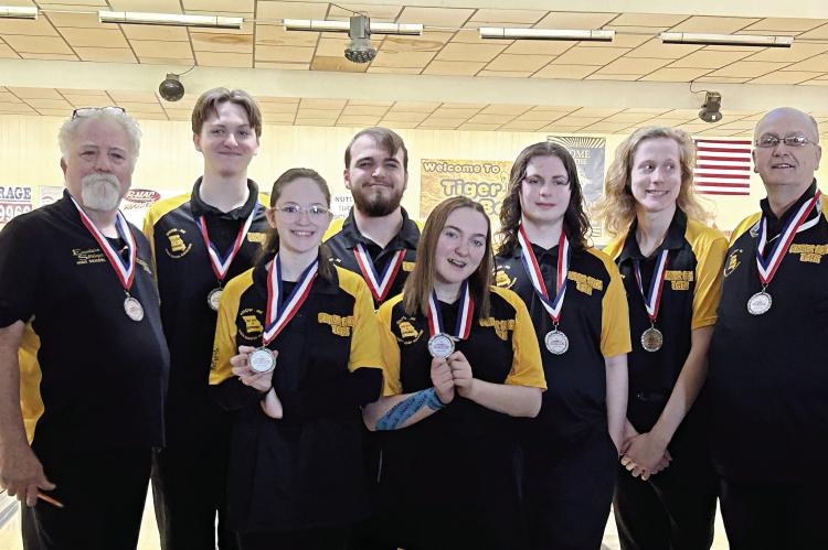 ON MAY 6, the Excelsior Springs High School club bowling team will travel to Union for state competition. From left, front row, are Quinlynn Davis and Olivia Smith; back row, coach Sam Stanton, David Falconer, Joshua Oldham, Brody Hurla, Colt Bowman and coach Jerry Ferrell. DUSTIN DANNER | Staff
