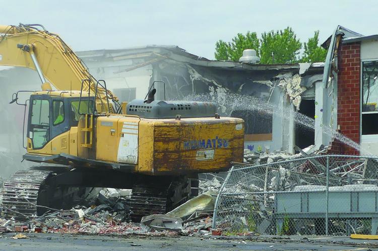 The back of Lewis Elementary school is torn down one room at a time. ELIZABETH BARNT | Staff