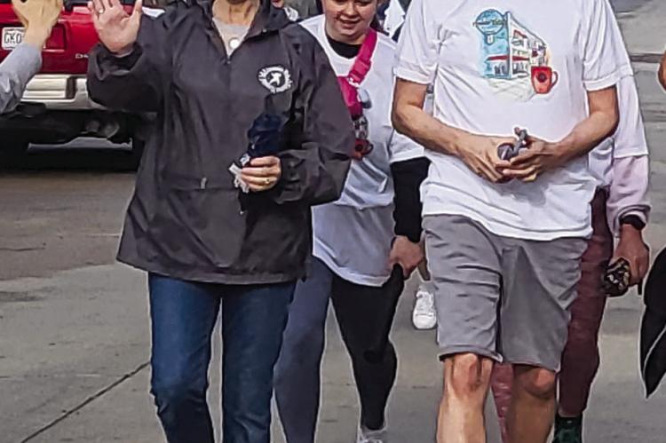 EXCELSIOR SPRINGS HOSPITAL employees Kristen DeHart (from left), Amy Shroye and Ethan Kent cross the finish line. SHARON DONAT | Staff