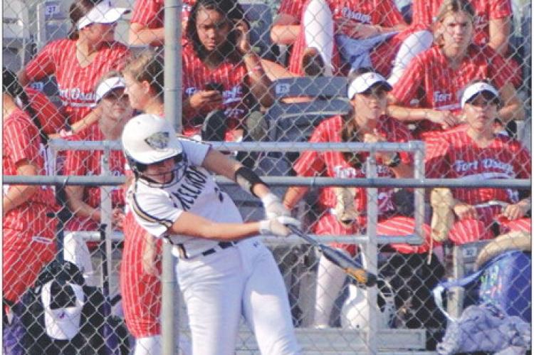 WITH A CROWD of Fort Osage softballers in the stands behind her, Excelsior Springs sophomore Kinley Rogers hits a home run to right-center field Sept. 12 at Miracle Field. DUSTIN DANNER | Staff